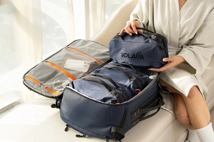Open Tolaccea Ulife 06 travel backpack in navy blue, neatly packed with matching organizational packing cubes.